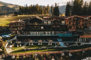 an aerial view of a resort in the mountains at Jufenalm BOHO & Wellnesshotel in Maria Alm am Steinernen Meer