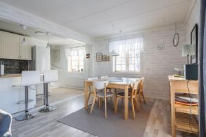 a kitchen and dining room with a table and chairs at Brunkulla - Tänndalen in Tänndalen