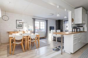 a kitchen and dining room with a table and chairs at Brunkulla - Tänndalen in Tänndalen