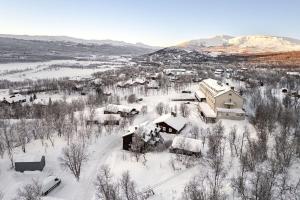 an aerial view of a village covered in snow at Brunkulla - Tänndalen in Tänndalen