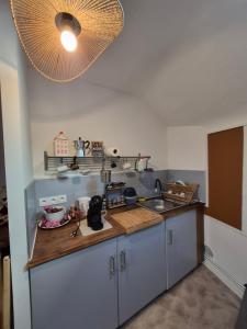 a kitchen with a sink and a counter top at Candy house in Salies-de-Béarn +7 photos
