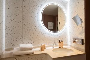 a bathroom with a sink and a mirror at Nice Centre Hotel in Nice +58 photos