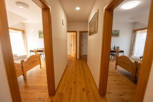 a mirror in a hallway with a dining room at Anivina - B&B in Ivanjkovci