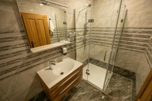 a bathroom with a sink and a shower at Anivina - B&B in Ivanjkovci +63 photos