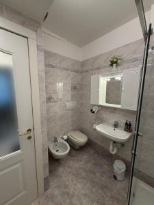 a bathroom with a toilet and a sink at Suite romantica a Como Centro in Como +15 photos