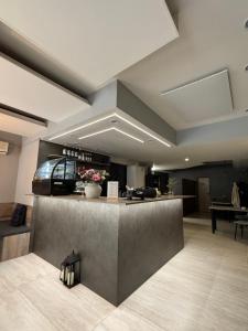 a lobby with a bar with a counter top at Penzion Vis a Vis in Třebíč
