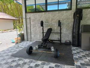 a black office chair sitting next to a wall at Than Khao Nature Resort and Homestay - Krabi Noi in Krabi