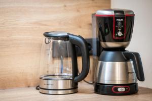 a coffee maker sitting on top of a counter at Ferienwohnung TaJoLe in Heinade