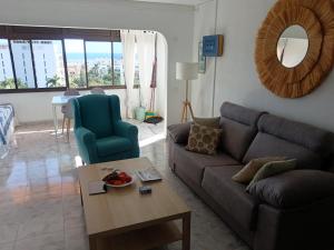 a living room with a couch and a table at Monte Rojo San Agustin in San Agustin