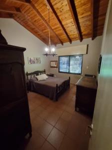 a large bedroom with a bed and a window at Casa a metros de todo in Federación
