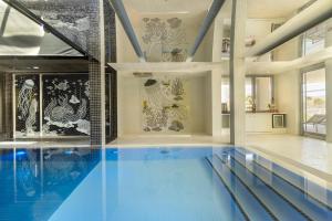 a large swimming pool in a house with a swimming pool at nhow Marseille in Marseille +81 photos