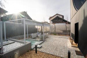 a backyard with a swimming pool and a house at Three Peaks Thermal Villas in Banya