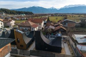 a view of a town with mountains in the background at Three Peaks Thermal Villas in Banya +29 photos