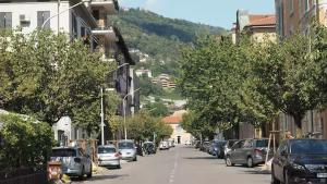 a city street with cars parked on the side of the road at Casa Pina in Como