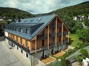 an aerial view of a house with a metal roof at Resort Aurum in Černý Dŭl