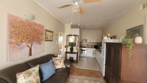 a living room with a couch and a kitchen at AtHome Apartments in Mokopane