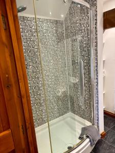 a shower with a glass door in a bathroom at The Swallows Rest, Avebury in Avebury +60 photos