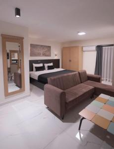 a large bedroom with a bed and a couch at La Vista in Gaziemir