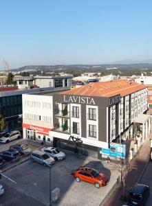 an overhead view of a city with cars parked in a parking lot at La Vista in Gaziemir