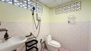 a bathroom with a sink and a toilet and a shower at Chill House in Ko Phangan +31 photos