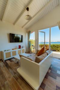 a living room with a couch and a view of the ocean at PK25 Dakhla in Dakhla