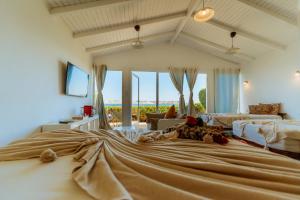 a large bedroom with a large bed with a view at PK25 Dakhla in Dakhla