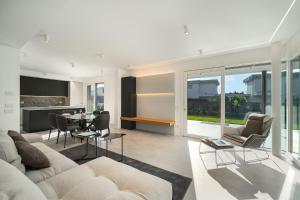 a living room with a couch and a table at NNV Pool Villa Lazise in Lazise