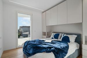 a bedroom with a bed and a large window at NNV Pool Villa Lazise in Lazise +35 photos