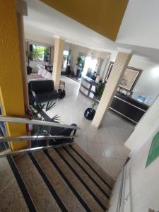 an aerial view of a living room with a staircase at Florença Hotel in Quedas do Iguacu