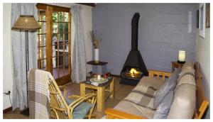 Ein Sitzbereich in der Unterkunft Vindoux Tree House Guest Farm & Spa