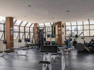 a gym with treadmills and machines in a building at Ibirapuera Premium Flat II in São Paulo