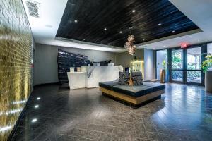 a lobby with a couch and a table in a room at Angler's Hotel - Miami Beach in Miami Beach +92 photos