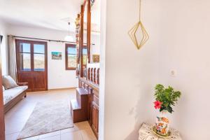 a hallway of a house with a staircase and a living room at Sofia Mike Houses in Olympos +33 photos