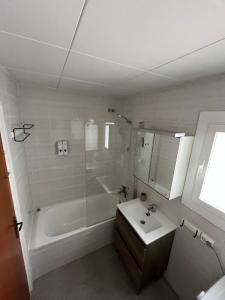 a bathroom with a shower and a sink and a tub at Close to the beach duplex in Tossa de Mar