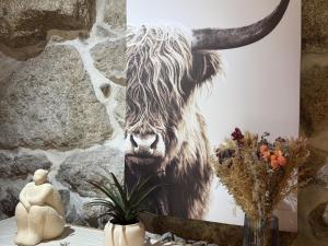 a painting of a bull on a wall at Serena Nest 02 in Cabeceiras de Basto