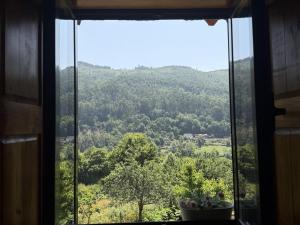 a window with a view of a mountain at Serena Nest 02 in Cabeceiras de Basto