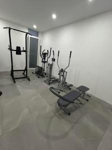 a gym with several exercise equipment in a room at Coral Reef Charming studio by the three old cities in Cospicua