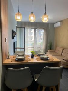 a living room with a table and chairs at Apartment N 1 in Chernomorets +2 photos