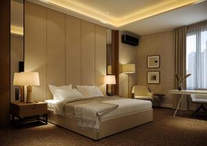 a hotel room with a bed and a desk at Carlton Hotel Tashkent in Tashkent +17 photos