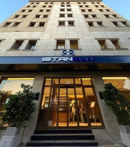 a building with a sign on the front of it at İstanblu Hotel&Spa in Konak