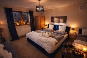 a bedroom with a bed with two pumpkins on it at Rioba Chalet in Nová Bystrica