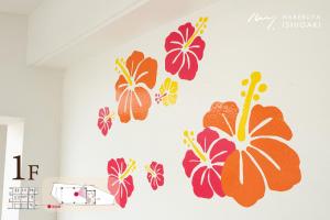 a wall sticker of hibiscus flowers on a wall at ハレルヤ石垣 in Ishigaki Island +60 photos
