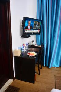 TV in/ali zabaviščno središče v nastanitvi Unique Cottages