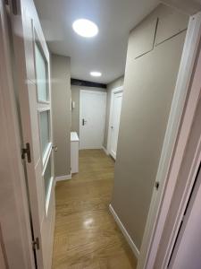 an empty hallway with a door and a room with a hallway at Apartamentos Castro Urdiales Centro con Parking in Castro-Urdiales