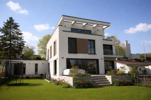 a white house with a lot of windows at RheinView Residence - Apartment in Mainz