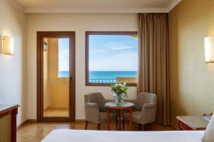 a hotel room with a view of the ocean at Hotel IPV Palace & Spa - Adults Recommended in Fuengirola