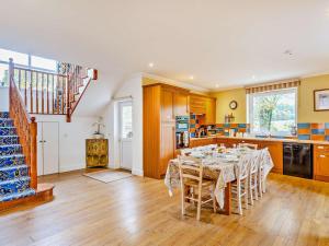 a kitchen with a dining room with a table at 3 Bed in Inverness oc-ca134 in Farr