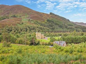 a house in the middle of a mountain at 1 Bed in Ardross oc-95533 in Alness