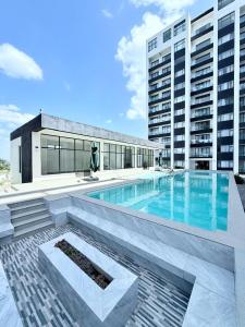 a swimming pool on the roof of a building at Acquila Crest by JKIA in Nairobi