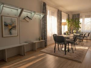 a dining room with a table and chairs at Noclegi PODZAMCZE PTTK in Przemyśl
